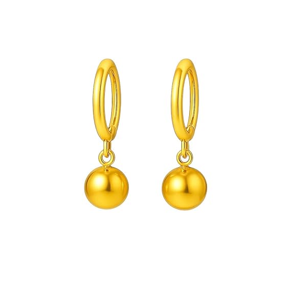 Pair of gold hoop earrings with round dangling charms on a white background