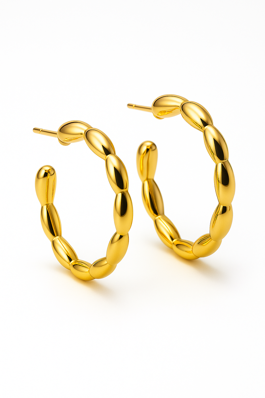 Gold hoop earrings on a white background