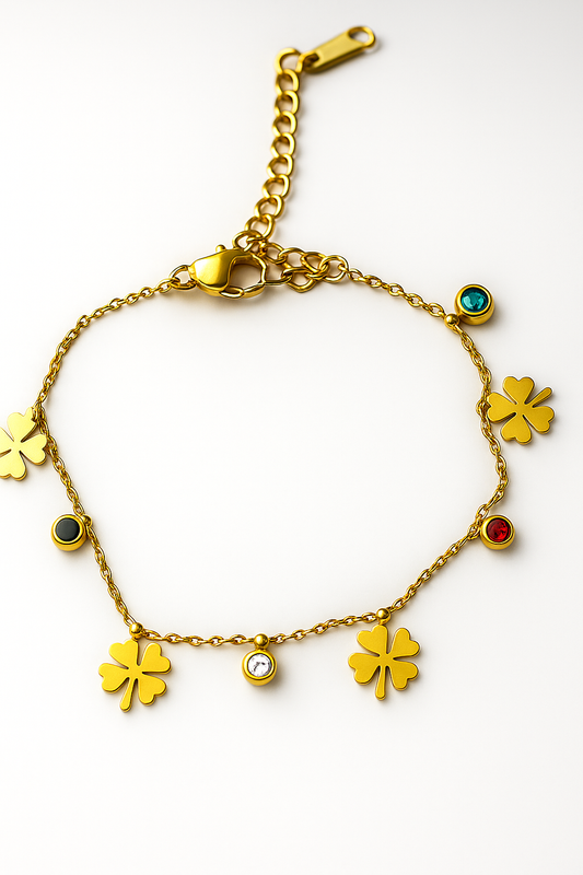 Gold bracelet with clover-shaped charms on a white background