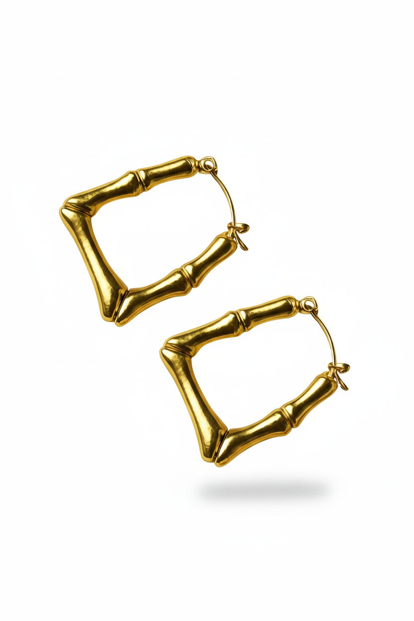 Gold hoop earrings on a white background